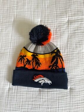 New Era Broncos Sunset Palm Pom Beanie in Navy, Orange, Yellow